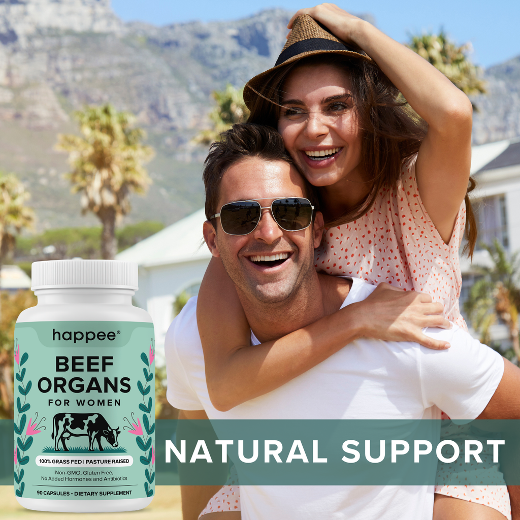 Couple enjoying a sunny day with a supplement bottle labeled 'happee Beef Organs for Women' in the foreground.

