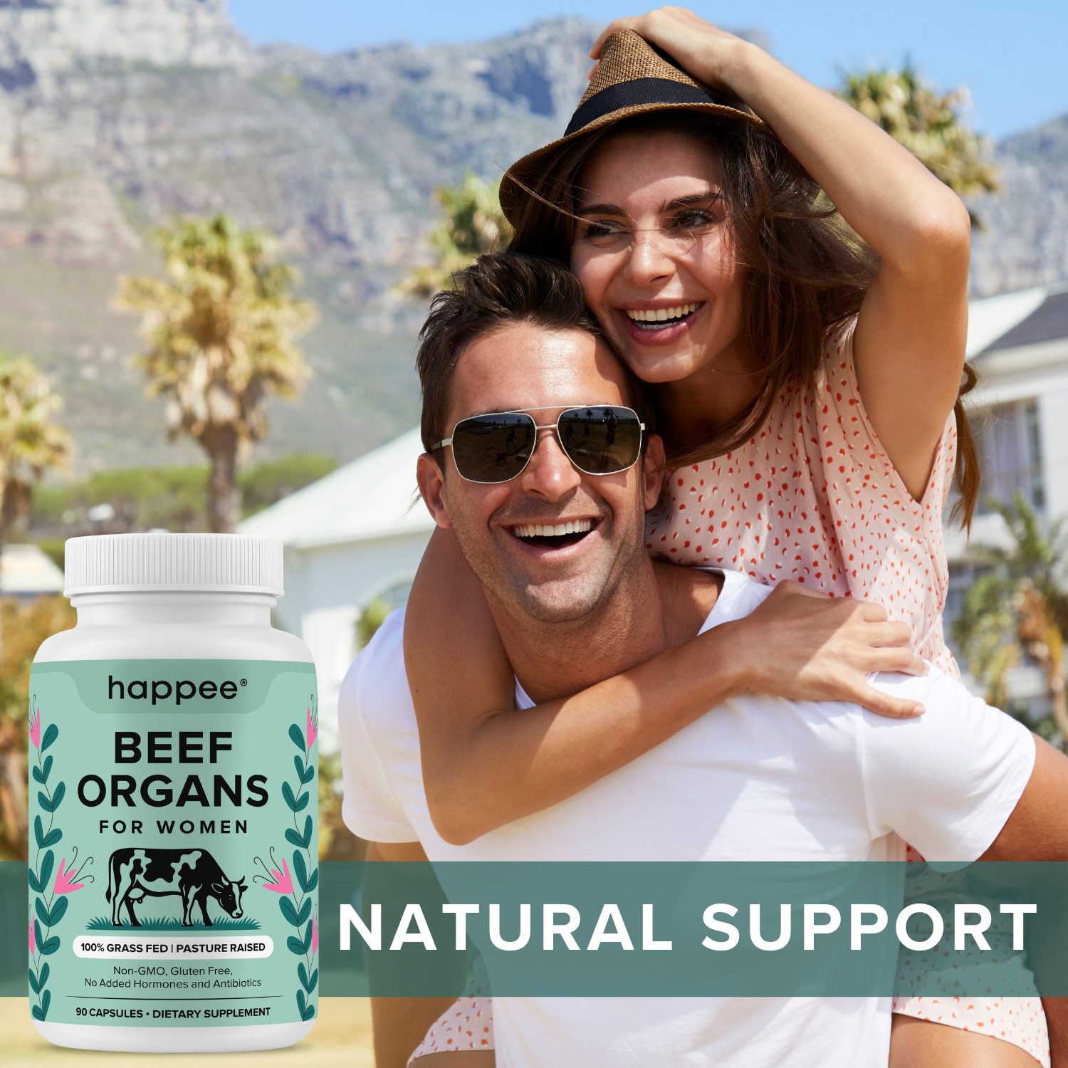 Couple enjoying a sunny day with a supplement bottle labeled 'happee Beef Organs for Women' in the foreground.

